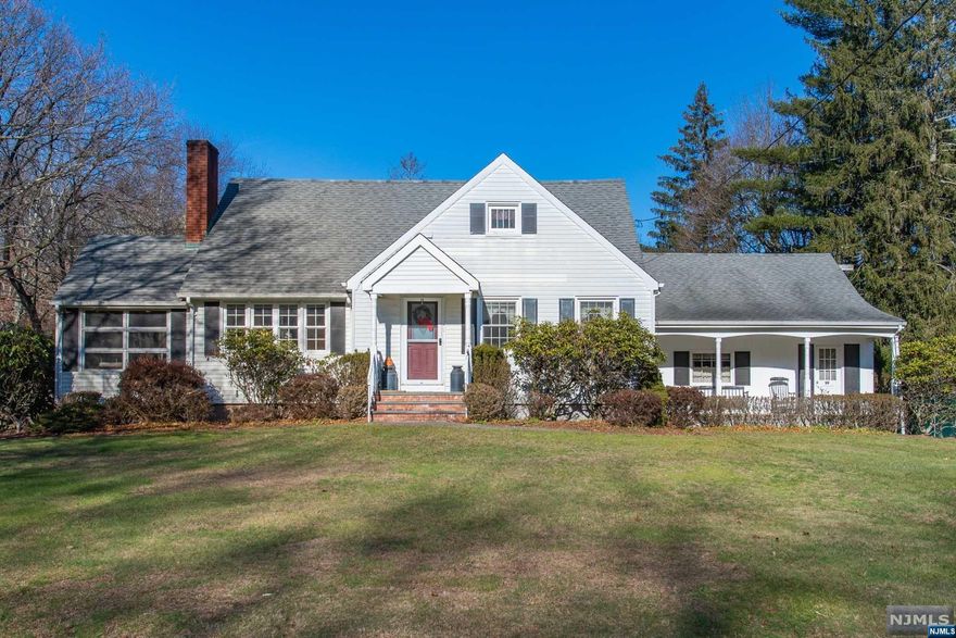 Nestled on over a half acre of property this charming home is ready for the next generation. The long driveway leads you around back to the extra-large attached 2 car garage with pull-down stairs to 2nd floor attic storage. This south facing home is filled with sunlight and faces green acres. Wildlife, nature and serene views are your neighbors. The 3 season porch is the perfect place to get away and enjoy your surroundings. This large open kitchen will be the heart of your new home. Relax on your front porch and take in the large front yard far from the road. 4 bedrooms with plenty of storage. If finished, the expansive basement with door to garage will be the perfect place to entertain or unwind. Centrally located near schools, award-winning town pool, library, the bustling downtown with cafes, restaurants and boutiques. This estate is being sold strictly in "as is" condition. Come see what this location has to offer and create the life you desire here, in the heart Ramsey