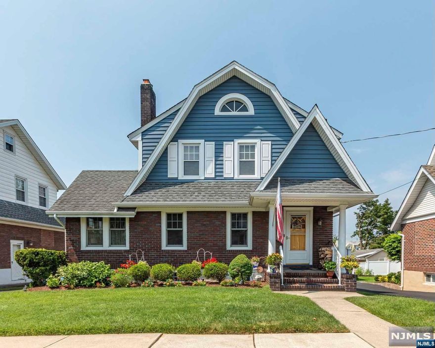 Welcome to this charming Roughgarden-Dator colonial home tucked away on a desirable block with beautiful curb appeal! The first floor offers a cozy living rm w/ a wood-burning fireplace, an elegant formal dining rm, a comfortable den, eat-in-kitchen & a convenient half bath. Moving upstairs, you'll find 3 bedrooms & a full bathroom. Step outside onto the beautiful deck adorned w/ a retractable awning overlooking the professionally landscaped yard complete with a meticulously maintained garden. This property also boasts a long driveway and a two car garage for your convenience. Inside, the home features hardwood flooring and original wood trim enhancing its classic appeal. Modern amenities include central AC (2nd fl)/ductless AC (1st fl)/central vac . Ample storage space throughout. Open basement awaits your personal touch to create your perfect space. Easy access to transportation and located within a much desired school district. Owned solar panels - enjoy reduced energy costs