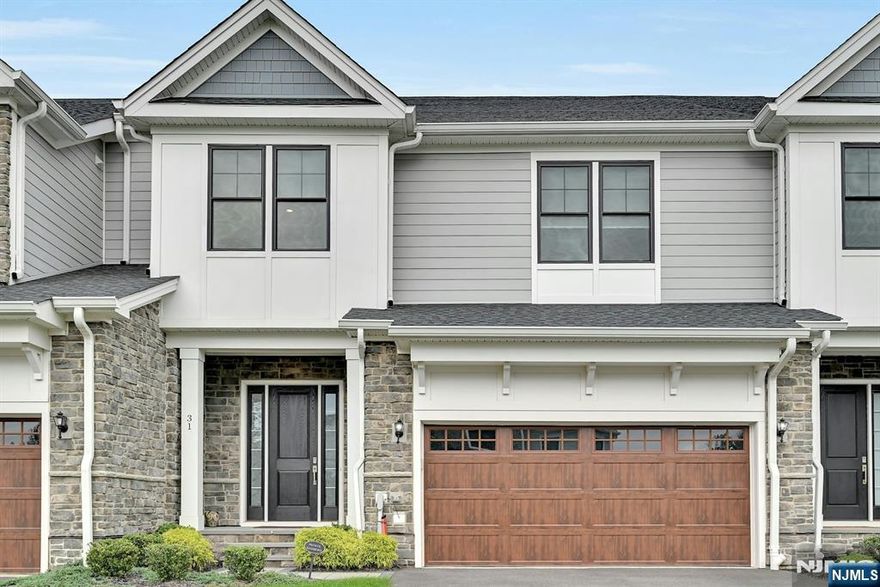 Luxurious Townhouse with Beautiful Upgrades in The Fairways at Edgewood! Welcome to the Elgin Model! This stunning home offers high ceilings, gleaming hardwood floors, and a modern open floor plan. The welcoming foyer opens to a large and bright living room with floor-to-ceiling windows for natural light throughout the first level. The gorgeous chefâ€™s kitchen features custom white cabinetry, a large center island, Caesarstone Primordia countertops, and high-end stainless steel appliances. The elegant dining room includes sliding doors to a private paver patio with a built-in grill, perfect for entertaining. A modern half bath, pantry, and custom closet completes the first level. Upstairs, the beautiful primary suite offers two custom closets and a luxurious primary bath with a soaking tub, separate glass-enclosed shower, and double vanity. Two generous guest bedroomsâ€”one with private access to the stylish guest bathâ€”plus a spacious laundry room completes the second level. The expansive finished lower level provides a large recreation room and a brand-new full bathâ€”ideal for guests. An attached two-car garage adds convenience to this exceptional home. Outdoor kitchen with grill Residents enjoy access to Edgewood Country Club (with membership fee), including pool, tennis, health club, and golf amenities. Don't miss the chance to live in luxury!