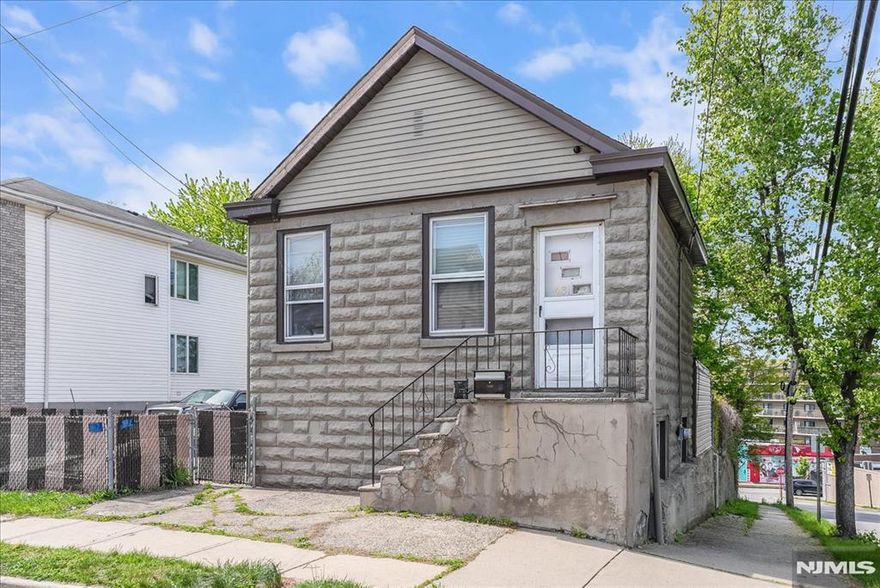 True 2 family home with tons of potential. Great investment property with separate utilities and a large lot. Significant potential for the right buyer. Unit 1 located on the 1st floor has 3BRs, 1 full BA, kitchen, dining area, living room & laundry area. Unit 2 located on the 2nd floor has 1 BR, 1 full bath, kitchen, dining area and a living room. Close to shopping, restaurants, highways and NJ transit. This property is being sold "AS IS".