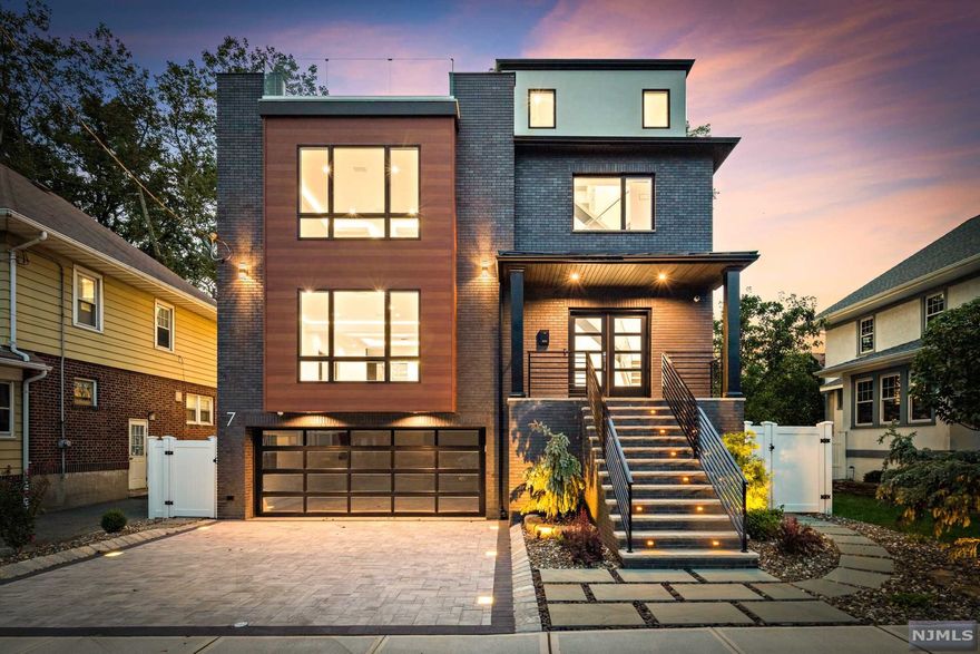 Welcome to the one of a kind, 7 Everett! A modern interpretation of a timeless and proven home design. Nestled in the most desirable location of Cliffside Park, just minutes away from NYC. Guided by the accent lighting, this home boasts modern & luxury as you walk through the thoughtful layout. No amenities were spared in this build from the wine cellar in the butler's pantry to massive steam shower in the Master Suite, this home strived to be the pinnacle of luxury and convenience. Voice-activated fixtures, recessed speakers throughout, built in coffee machine, double island, glass railings and much more. This state-of-the-art home is a must see to truly appreciate it!