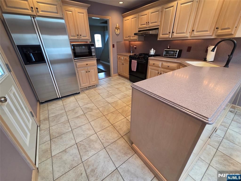 Photo of 77 Graham Terrace, Saddle Brook, NJ 07663 (MLS # 25036042)