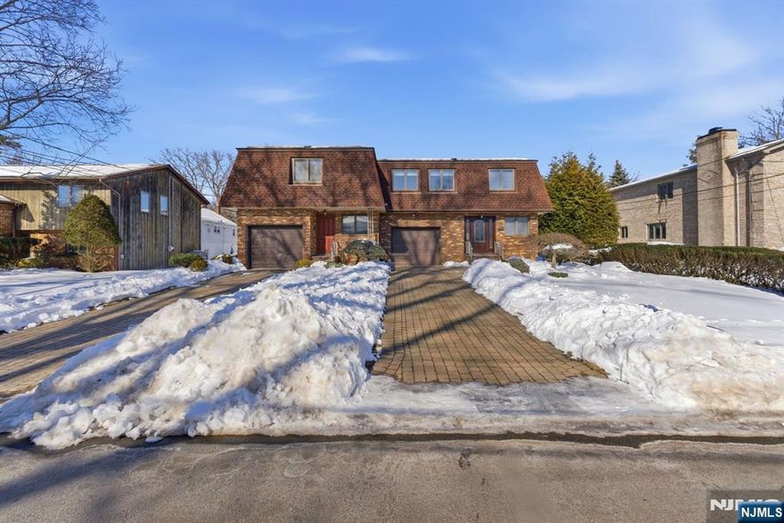 Welcome to this meticulously maintained duplex in the heart of Tenafly, a highly desirable neighborhood known for its charm and convenience. This inviting home boasts a spacious main level featuring a welcoming entryway, a generous living room complete with a cozy fireplace, a formal dining area, and an updated kitchen. A convenient powder room completes this level. Upstairs, the serene primary suite offers a full bath, complemented by two additional bedrooms, a shared full bath, and a versatile space ideal for an office or nursery. The finished basement enhances the living area with a recreational room, an additional full bath, laundry facilities, and ample storage. Modern comforts include central air conditioning and newly installed hardwood floors. Outside, enjoy a delightful backyard and the convenience of a one-car attached garage. Lawn maintenance is included, ensuring a pristine outdoor space year-round. This exceptional property is located near top-rated schools, vibrant dining and shopping options, and offers easy access to NYC transit. This is a prime rental opportunity in a sought-after location, perfect for those seeking both comfort and convenience.