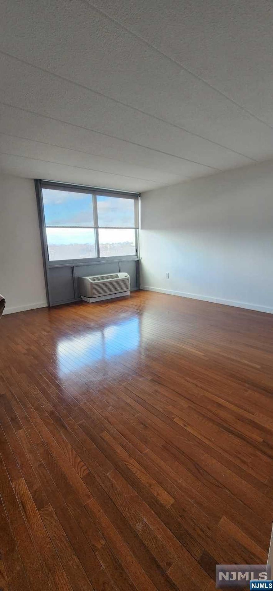 This apartment home offers hardwood floors & all large windows. YES, ALL UTILITES ARE INCLUDED! LL covers your WATER & ELECTRICITY. PET FRIENDLY. Oversized windows allow lots of natural light into this lovely home. Move right in and enjoy the convenience of walking to shops, markets, schools and much more. Just steps to NYC transportation and minutes' drive to NYC. Enjoy the 'no frill' easy living. Morning to evening concierge service, 24 emergency maintenance, indoor garage parking & limited outdoor parking spaces, mall level access to shopping, pet walk and so much more! On-site storage space and garage parking available for additional cost.