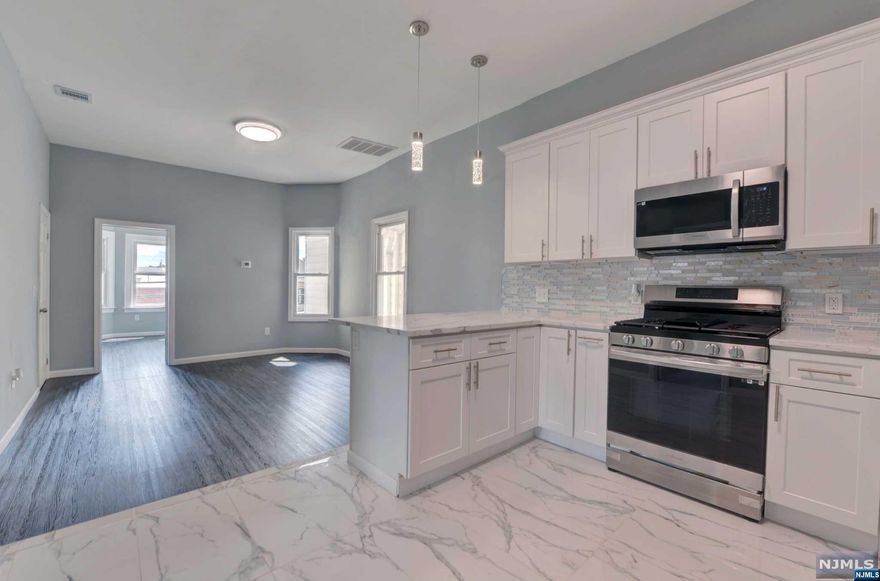 ***Price Reduced for a Quick Sale*** Seller may Help with some Closing Costs*** Beautiful property. Completely renovated 2 family. New Central Air condition in both units. Move In Condition. Updated kitchens with new appliances and open concept, bathrooms have also been updated. Detached 2 car garage. Large double lot may offer other building possibilities. Great location, near stores, public transportation to NYC, close to all major highways, routs 80, 46 & others. Let tenants help pay your mortgage. Rent for 2nd floor is projected.