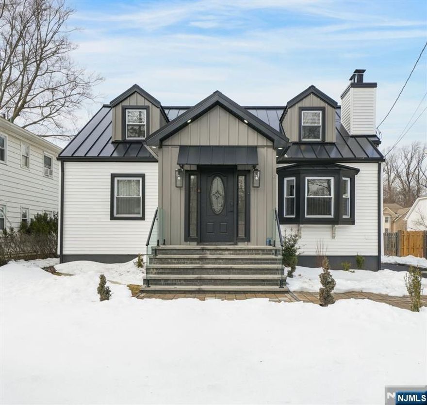 This completely renovated home offers approximately 2,500 square feet of beautifully designed living space. Located on a quiet street in a highly desirable West Orange neighborhood. Featuring an open floor plan ideal for modern living and entertaining, the home showcases a stunning gourmet kitchen with stainless steel appliances, wine refrigerator, granite countertops, and detailed finishes throughout. The inviting living room boasts a charming wood-burning fireplace and flows seamlessly into the dining area. First floor includes a bedroom and main bath. Second level offers a private primary suite with a luxurious primary bath and stall shower, an additional bedroom and a versatile office area. The fully finished lower level provides extra living space, a full bath, laundry area and ample storage. Exterior upgrades include new siding, Standing-Seam metal roof, driveway, stairs and railings. Completing the property is a two-car detached garage, abundant parking, grassy area with a shed and privacy fence perfect for relaxing or entertaining. Ideally located just minutes from Turtle Back Zoo and South Mountain Reservation, this home also offers convenient access to the local Park-and-Ride with shuttle service to nearby train stations, making commuting a breeze.