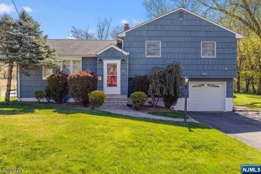 Spacious 3-bed, 2-bath split-level home nestled on a serene street. Enjoy easy access to school, bus stop, town pool, and highway. The main floor showcases a bright living room, dining room, kitchen and sunlit family room with high ceilings, skylight, and access to a generous deck and backyard. The ground level features a gym/craft area while downstairs offers a versatile nanny/rec room. Renovated in 2018, including kitchen, baths, and flooring, this home boasts an inviting open concept perfect for modern living.