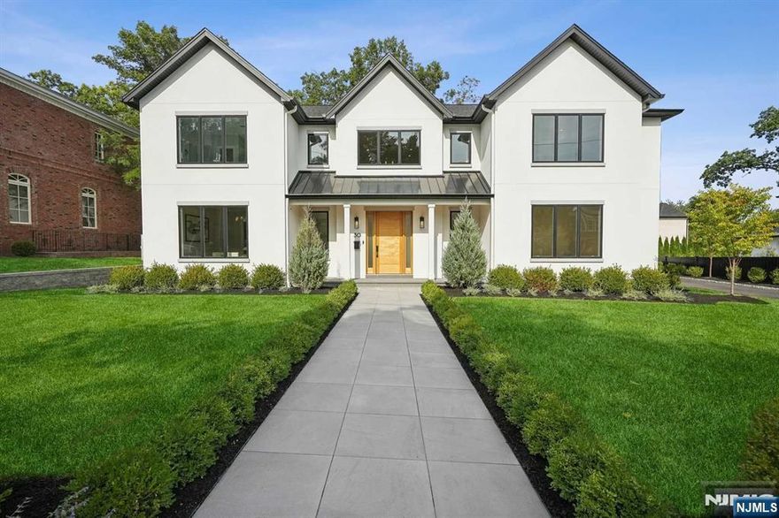 Welcome to your dream home on the upper North side of Englewood Cliffs. This newly built 6-bedroom, 7-full/2-half bath residence embodies contemporary elegance and masterful architectural design. Outside, relax on the serene covered porch, equipped with a built-in grill and cabana bath, overlooking a saltwater pool and spa, set amidst beautifully landscaped grounds. The main level welcomes you to a luxurious, open-concept layout, where the gourmet kitchen, dining room, and great room flow seamlessly together. This floor also offers a private office, guest suite, and powder room, perfect for entertaining and practicality. Upstairs, an open family room leads to the luxurious primary suite, along with three additional bedroom suites and a convenient laundry room. The finished lower level includes spacious recreation rooms, a gym, an additional bedroom suite, and a guest powder room. High ceilings, extensive radiant heat, 5" white oak flooring, transitional finishes. Move right in!