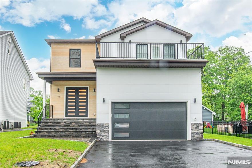 Stunning 10-month-young home in Livingston customized with a professional interior designer. This 5BR/5.5BA home has 10' ceilings on the first floor, high-end custom finishes, finished walkout basement. 1st floor includes open floor plans with spacious entryway, living room, dining room, and kitchen perfect for cooking and entertaining. Gourmet kitchen features high-end stainless-steel JennAir appliances, beautifully designed cabinetry to ceiling, custom open walnut shelves,range hood, quartz countertops, oversized island, and sliding doors that lead to a private patio and fenced backyard for excellent outdoor living. Guest bedroom with en-suite bathroom, mudroom with access to attached 2-car garage with EV charger, and powder room. 2nd floor contains primary suite, jack-and-jill bedrooms with private balcony, a fourth bedroom, bonus office, and laundry room. Primary suite boasts tray ceiling, spa-like bathroom with tub and shower, 2 walk-in closets with custom cabinetry, and private balcony. Finished walkout basement has enormous common space with room for a gym,fully wired media room with platform, recreation room, full bathroom, built-in dry bar.Approximately $25K/year in property taxes and 10-year builder warranty. Close to top-rated schools, shopping, dining, playgrounds and parks, easy access to NYC transit. This home offers all the advantages of a new construction with the function and quality of a home built with a professional interior designer. A must-see!