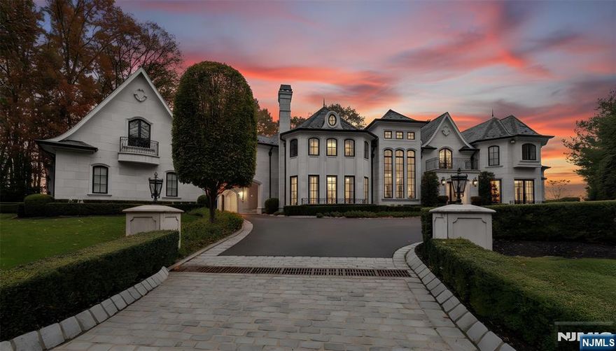 Breathtaking French Chateau style estate perched on one of the highest points in River Vale, offering sweeping mountain views and set at the end of a quiet cul-de-sac. This extraordinary residence seamlessly blends elegance, craftsmanship, and modern luxury, featuring 6 bedrooms, 5 full bathrooms, and 3 half bathrooms. Enter through the impressive two-story foyer with a sweeping staircase and enjoy beautifully proportioned formal and informal spaces, including a gourmet chefâ€™s kitchen with butlerâ€™s pantry, a dramatic two-story great room with fireplace, formal living room, piano room, sophisticated bar, handsome study, breathtaking library with fireplace, and an elegant dining room with its own fireplace. The grand staircase leads to the second level, where open views overlook the great room below. This floor features two private en-suite bedrooms, two additional bedrooms connected by a Jack-and-Jill bath, and the exquisite primary suite, complete with FP, dual walk-in closets, spa-caliber marble bath, private sitting room, and a balcony showcasing serene park-like grounds and mountain vistas. Additional highlights include 4 garage spaces with a porte cochere and meticulous architectural details. The newly finished lower level further elevates the home with a large recreation room, custom bar, guest bedroom, 1.5 baths, and a home gym. A spectacular residence that truly makes an unforgettable impression.