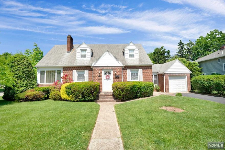 Prepare to fall in love with this charming Cape Cod home in Hackensack's desirable Fairmount section. Just a short walk to beautiful Staib Park & minutes from NYC transportation, it is truly the best of both worlds! The spacious main floor features a large living room with fireplace, a lovely dining room, and a true eat-in-kitchen that leads to a breezeway perfect for relaxing with a glass of lemonade & a good book. It also boasts a bedroom (currently in use as a den) that opens to a fully heated/air conditioned sunroom with lots of natural light. A full bath completes the main level. Upstairs you will find the primary bedroom complete with a bonus room that can be used as a nursery, office, private sitting room, or home gym along with a 3rd bedroom and a 2nd full bath. The finished basement offers lots of storage space (three large closets!), plus a rec room or family room with a bar, a laundry room, a utility room, and a bonus room. Don't miss this opportunity!