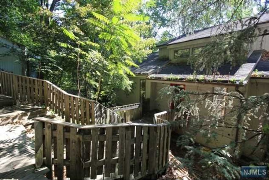 Investors Dream ! Great Opportunity ! This Contemporary boast 6 Bedroom and 3 baths. Fantastic views what ever window you look through. Hardwood Floors. House is in terrible condition - Completely "as is " condition - buyer responsible for CO and all past permits .