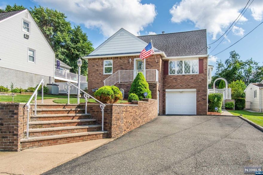 This charming expanded Cape Cod is the definition of pride of ownership! Move right into this 4 bedroom, 3 full bath home. The first floor features an open concept living room, dining room, updated kitchen in April 2019 with eating area and a large family room. The family room sliding doors lead out to a breathtaking, oversized (25'x35'), maintenance free Trex deck, done in Nov 2022, that is perfect for gatherings. The deck overlooks a beautifully landscaped backyard with underground sprinkler system. Also on the first floor is the primary bedroom with its own ensuite bath with a stall shower. Towards the front of the home is the second bedroom that can also be used as an office. Washer/dryer conveniently located in a closet in the family room. A full bath renovated in 2017 completes the first floor. On the second floor you will find two more bedrooms and a full bath with stall shower. There's plenty more living space in the finished basement that has access to the one car garage.