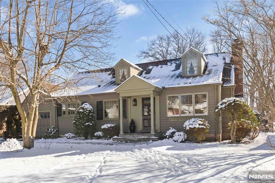 Step inside this charming, expanded cape & realize it is larger than it appears - offering approximately 2,300 sq ft of living space. Quality craftmanship, good size rooms, crown moldings, a classic fireplace/mantel & lots of natural light. Wood floors are under most carpeted areas of the house. Retro 1984 Ulrich kitchen opens into a gracious family room with beautiful wide plank wood floors. 2 bedroooms, office space, & full bath upstairs. 2 bedrooms & full bath downstairs for potential one-floor living. A have-company-over sized screened porch overlooks the expansive, level, back yard. Perennial gardens will bloom & summer entertaining will be a pleasure! Great location near top rated Glen Rock schools. The high school, middle school & elementary school are just blocks away. Close to town, restaurants & shops, TWO train lines & express bus to NYC. Commuters take note! There is no town like Glen Rock for community & convenience. Houses like this do not come to market often. Come see it!