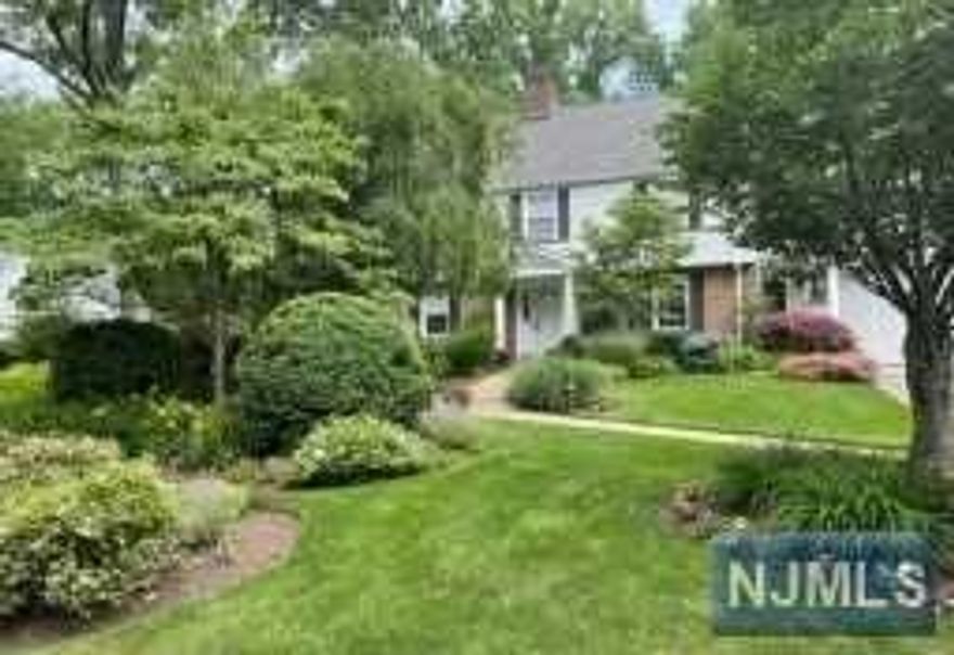 ELEGANT & METICULOUS CUSTOM CHC WILL CAPTIVATE YOU INSIDE & OUT. SURROUNDED BY LUSH MATURE LANDSCAPING ON ALMOST .5 ACRE LOT. ENJOY SUN DRENCHED ROOMS WITH HDWD FLOORS & WINDOWS OVELOOKING THE PICTURESQUE PROPERTY. 1st FLOOR BOASTS A LG LR W/WDBR FP, FORMAL DR, UPDATED EIK W/SS APPLIANCES, GRANITE COUNTERTOPS & CUSTOM PANTRY. RELAX IN THE COZY DEN OR THE LG HOME OFFICE/BR. UPSTAIRS YOU WILL LOVE THE MASTER EN-SUITE W/CUSTOM CALIFORNIA CLOSET/SITTING ROOM. ENJOY 2 MORE LARGE BR + 2 FULL BATHS PLUS MAIDS QUARTER-4TH BEDROOM OPTION. CONVENIENTLY LOCATED LAUNDRY CENTER,TONS OF CLOSETS & WALK UP ATTIC MAKE THE SECOND FLOOR COMPLETE! LOWER LEVEL IS FULLY FINISHED W/WATERPROOF FLOORING, BILLIARD/GAME RM, CUSTOM BAR & REC RM, 1/2 BATH & LOADS MORE STORAGE SPACE. NEW ROOF (2015) NEW CAC (2019) NEW BOILER (2018) NEW H2O HTR (2018) CUSTOM BUILT BACKYARD SHED, ELECTRIC CAR CHARGER & IN GROUND SPRINKLER SYSTEM, OUTDOOR LANDSCAPE LIGHTING. STEPS FROM RIDRIDGEWAY PARK & NYC COMMUTER JITNEY.