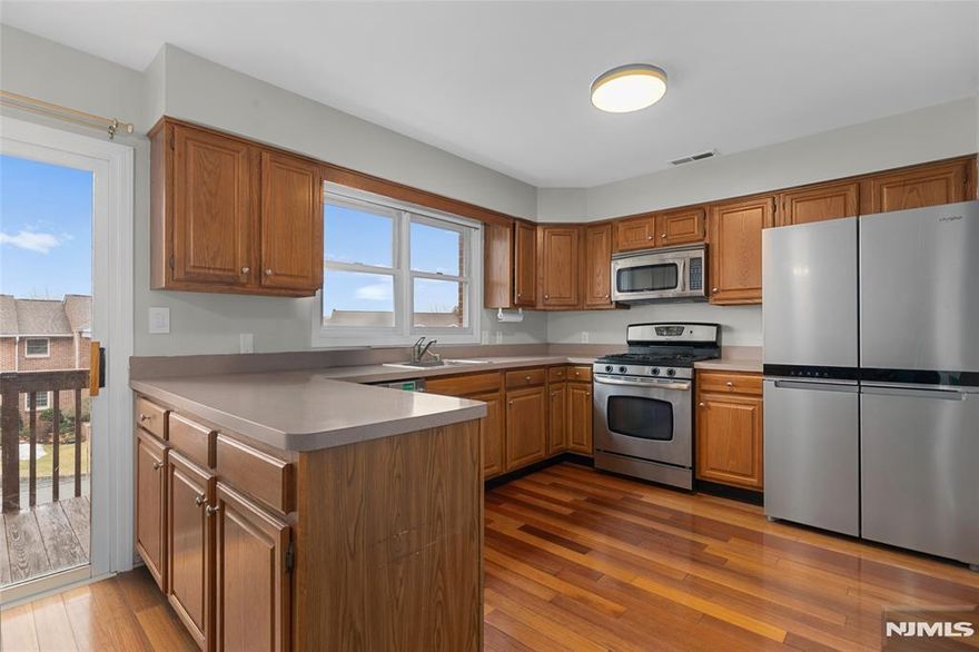 This stunning 3-bed, 2.5-bath townhouse in the highly sought-after Beacon Hill community features an open floor plan w/ high ceilings & hardwood floors throughout. The main level offers a welcoming foyer, a cozy living room w/ a wood-burning fireplace, an eat-in kitchen w/ a large pantry & a second living area. Large windows fill the space w/ natural light. Enjoy peaceful views from the front deck & private back paver stone patio. Equipped w/ smart devices, including door locks, a thermostat, & light switches. Upstairs, the expansive primary suite has a large over-sized closet & en-suite bath. Two additional well-sized bedrooms and updated bathrooms complete this level. The finished basement includes a rec room & laundry area, while the attached 2-car garage provides convenience & ample storage. Located minutes from charming downtown, with shops, restaurants, and cafés, and easy access to Routes 23, 287, and 202, this townhouse is ideally situated and perfect place to call home!