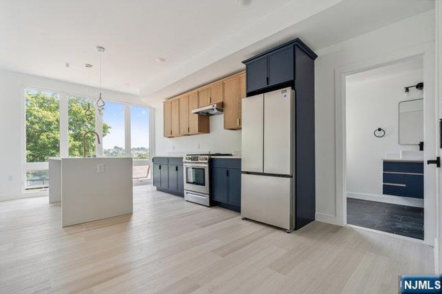 Welcome to this amazing newly constructed building located in the HEART of Belleville. Enjoy rooftop access with city views. Step inside your bright & airy 1 bedroom, 1 bathroom apartment. Our front units include floor to ceiling windows with custom shades, gorgeous kitchen cabinetry- and plenty of it! The kitchen offers quartz countertops, stainless steel appliances, and a pantry. Step into the bedroom which has a double closet and plenty of natural lighting for a wonderful start to the day. Full bath with tub. Units have central air, forced hot air, 1 assigned parking space and rooftop access w/ 2 pergolas. Walk out your front door and stroll to shops, eateries, coffee shops, and countless other businesses. Close to public transportation! Tenant pays gas, electric, hot/cold water.