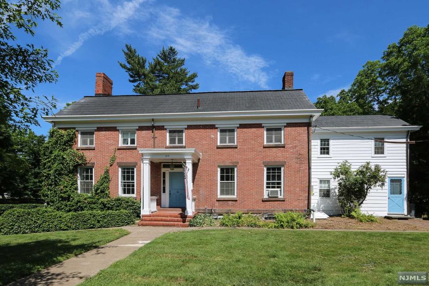 Come experience this incredible 4/5 bedroom 3 1/2 bath early American colonial with bygone elements such as original wide plank wood flooring throughout. The large kitchen with cathedral ceilings and wood beams opens to an inviting den for extended entertaining. Rooms are generously sized and the original fireplaces add a warm feel to several rooms throughout the home. The 1+ picturesque acres and brick entry porch welcome visitors into this charming home of distinct character. A truly intoxicating home with some unique elements such as original smoke house along side walk out basement and vegetable garden area. Large rear yard with sizable patio make for perfect entertaining. With a few enhanced personal touches on this remarkable property, the home could be perfect for new generations. Conveniently located to shopping, houses of worship, and dining. Easy access to main thorough fares and transportation.