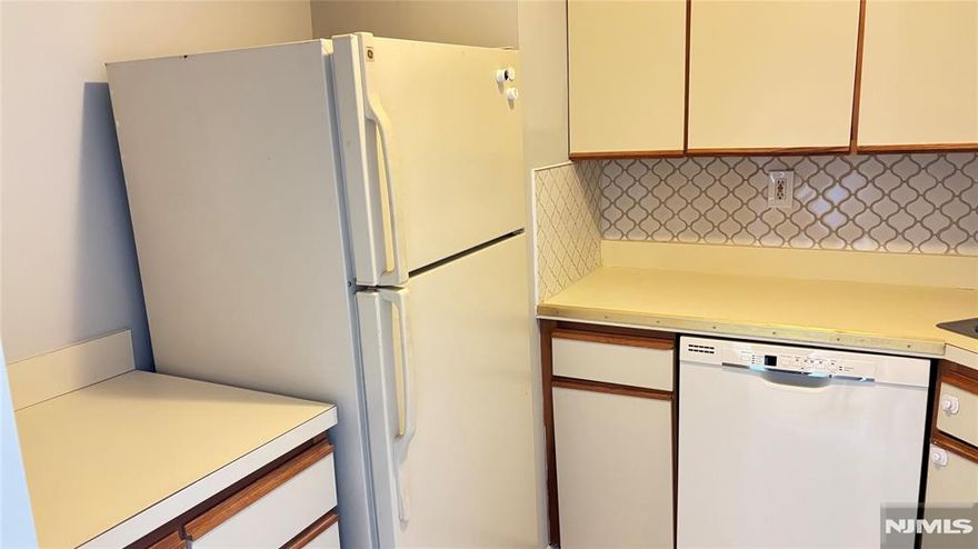 Experience comfortable and convenient living in this beautifully maintained second-floor unit at Harrison Bridge Tower Condominium. This spacious home offers 2 bedrooms and 2 full bathrooms, featuring high ceilings and wide corridors that enhance the open and modern feel of this unique building. Enjoy convenient amenities including one indoor garage parking space, central air and heat, in-unit laundry, dishwasher, refrigerator, microwave, and stove, as well as elevator access and a recreation room for residents. The building is equipped with a front-door camera security system and building-wide security for added peace of mind. All appliances are electric, and the owner covers both water and monthly condo maintenance fees. Available for immediate move-in. No pets, waterbeds, or fish tanks permitted. Donâ€™t miss the opportunity to live in this exceptional and well-appointed condominium.