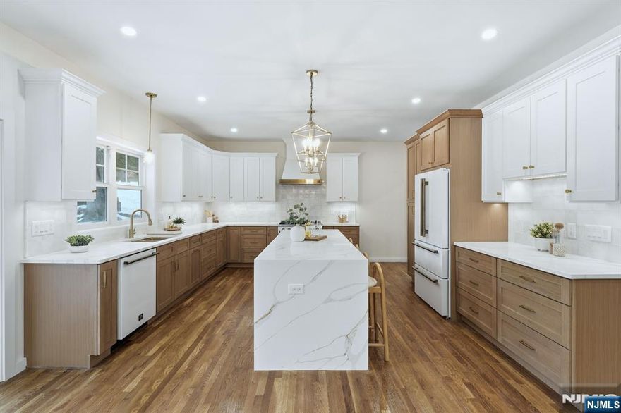 Welcome to this beautifully renovated side-hall Colonial,where timeless architectural charm meets modern luxury living.This elegant home offers four generously sized bedrooms, three full bathrooms & one powder room,all thoughtfully reimagined w/exceptional attention to detail.Refined finishes throughout include sophisticated custom molding,designer lighting & premium quartz countertops.The gourmet chef's kitchen is a true showpiece,featuring top-of-the-line Forno Galiano appliances,an expansive island w/waterfall countertops & a refined design ideal for both everyday living & entertaining.The adjoining living & dining rooms flow seamlessly & are enhanced by a cohesive molding package,adding warmth & timeless elegance.Upstairs,the primary suite provides a serene retreat w/2 walk-in closets & a spa-inspired en-suite bathroom complete w/a walk-in shower & double vanity.Two additional bedrooms on this level share a beautifully full bath.A separate bedroom suite w/its own full bathroom offers the perfect space for guests.A 2nd floor laundry room w/sink & cabinetry adds exceptional convenience, while the finished basement provides valuable additional living or recreation space.Ideally located w/in walking distance to NYC transportation & Cedar Grove's vibrant town center,this home offers effortless access to restaurants,boutique shopping,banking,& transportation.Experience the perfect balance of classic Colonial character & contemporary comfort in this truly exceptional residence.