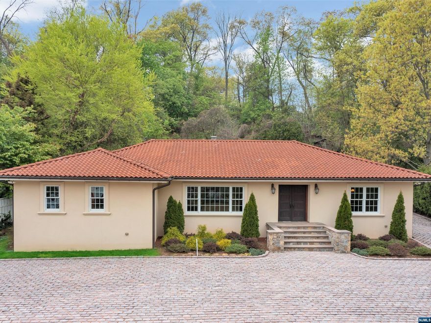 Welcome to this stunning ranch-style home w/3 bedrooms & 3 full baths! The inviting foyer leads to a gourmet kitchen w/ custom copper hood, Wolf cook top, Sub Zero fridge, & coffee station. French doors open to a banquet-size dining room, living room, & family room w/wood-burning fireplace (AS IS) with custom built-ins. Large sliders open to the patio & heated gunite in-ground pool, perfect for outdoor entertaining. The Master Bedroom boasts a spacious layout, walk-in closet, MBTH w/separate shower & soaking tub. Two additional generous bdrms, fbth, & laundry rm provide added convenience. The bsmt includes a summer kitchen, huge rec room, den/office, & ample storage space. Add'l features includes a circular paver driveway, travertine patio, Ludowici clay roof, 2-detached car garage, sprinkler sys, & Brazilian hdwd floors. Conveniently located near downtown Westwood, train station & NYC. This is an "estate sale" being sold strictly AS IS with no credits or repairs will be issued.