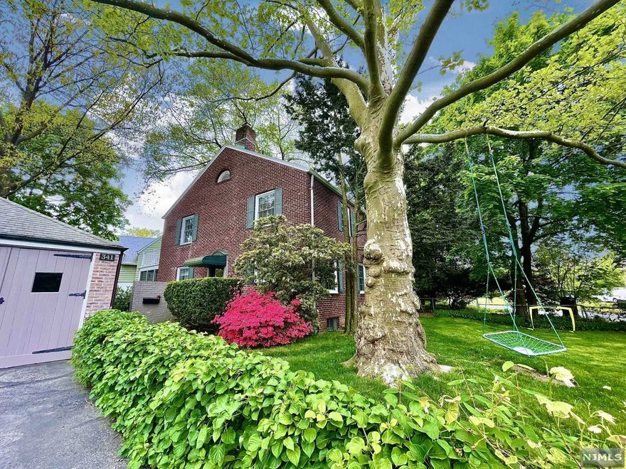 Nestled in the historic community of Radburn, this pretty brick colonial home is bursting with stylish updates and charm w/ high-end updates and designer touches. A custom kitchen features stone counters, new appliances, and total functionality as it opens to the formal dining room. The lg living room drowns in sunlight all day through new Marvin windows reflecting off original hardwood floors. 3 well-appointed bedrooms and a classically updated full bathroom round out the upstairs. The basement features a fin rec-rm, lg laundry room, storage+utility space w/exit to an exterior stairwell. Round it all off w/ a delightful screened porch, garage, fenced yard and path access into B park. Radburn Association offers 2 pools, tennis, playgrounds, miles of walking paths, camps, and year-round activities for all ages. Just 0.5 miles to the NYC train and bus, center of town and RT 208. Minutes to world-class shopping and dining and all that Bergen County has to offer.