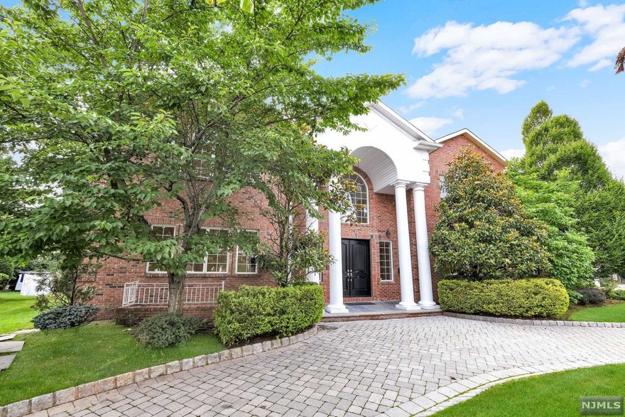 First time offered since full home renovation!!! Prime Location North Englewood Cliffs!!! All brick magnificent builder's home with top amenities, radiant heat, marble foyer, marble baths, high ceilings through out, 14 zone heating, truly a masterpiece. Custom Kitchen w/Viking Stove ,Sub Zero and butler staircase. This amazing home offers 8 En-Suite Bedrooms including one on the first floor!!! The magnificent beautiful master suite with fireplace features a marble master bath with radiant heat. Walk through laundry room upstairs, hardwood floors through out, details galore. Full finished walkout basement with 10ft ceilings and large windows, movie theater, wine cellar and custom wet bar. Paver circular drive way, 3 Car Garage and private backyard. Located only minutes from Manhattan in one of the most desirable areas.