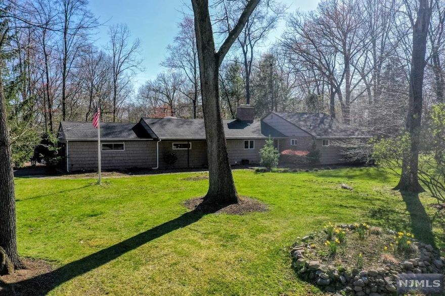 Welcome to this wonderful ranch on private Riverview Terr USR. Nice open floor plan concept. Cozy living room and dining room with hardwood floors throughout, brick fireplace and a wall of windows overlooking the back patio and pool. Nicley updated kitchen with stainless steel appliances and granite countertops offering bar stool seating. Large living room with recess lights and ceiling fan. Mudroom off the garage. Primary suite with updated bathroom w steam shower. Two additional bedrooms with an updated hall bathroom and jacuzzi tub. Large paver patio in rear with heated Gunite pool. Two car garage, central AC, water softener. Flat Lot. Great Upper Saddle River schools. House to come with a new septic before closing.