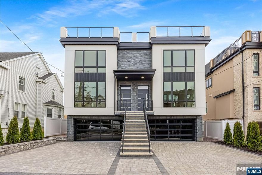 Welcome to the Eastside of the Palisades! Professionally landscaped W/Rooftop Views of a breathing taking skyline. Top of the line construction condo/townhouse, Large kitchen offering Stainless Steel BOSCH Appliances oven is WIFI, Quartz countertops with a center island, with access to a balcony made of TREX DECK, Walk through the beautiful White OAK floors to the dining room and living room with a fireplace and a 1/2 bath. The second level where you will meet a primary bathroom with spa like features A soaking tub, separate shower double sink all GROHN and Swiss Madison hardware, Hansgrohe mirrors, and tiled for a clean look, there are 2 additional bedrooms and a full bath with beautiful finishes, Electrolux Washer/Dryer and NuTone central Vacuum system. Run up to the loft that features a half bath and opens up to the roof top for entertaining.. The ground level includes a family room, a bedroom/den with a full bath great for an in law suite or nanny. All custom closets & GHROHE and HANSGROHE trim through out. this place you will soon call home has additional features 2 car garage /w additional 2 outdoor spaces. Approx. 3300sqft of living space. 9FT Ceilings, 1 block to NYC transportation, Shops, many restaurants with of a variety of cuisines, Quaint coffee and bakery shops, personal care salons, and a medical center. Parks, schools, and house of worship through-out the town. Very family oriented with many seasonal activities . Come to your new home town of Cliffside Park.