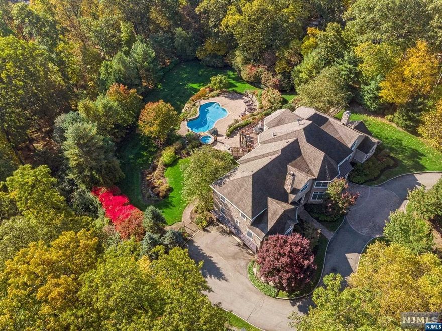 Custom Built Smoke Rise residence, hits the market for the first time ever! Built in 2006 and only 30 miles from NYC, this state of the art 10,000 sqft. masterpiece boasts an impressive 30 rooms. With a total of 5 Bedrooms plus 2 bonus rooms and 6.5 bathrooms that offer versatility for all your unique needs including a potential in-law suite or separate caregiver space.This home exudes warmth and elegance with four fireplaces, three of which are gas and one wood-burning. Impressively High ceilings with massive floor-to-ceiling windows infuse every corner of the home with an abundance of natural light. The open and airy design ensures that every room is bathed in sunlight, creating a welcoming and refreshing atmosphere.