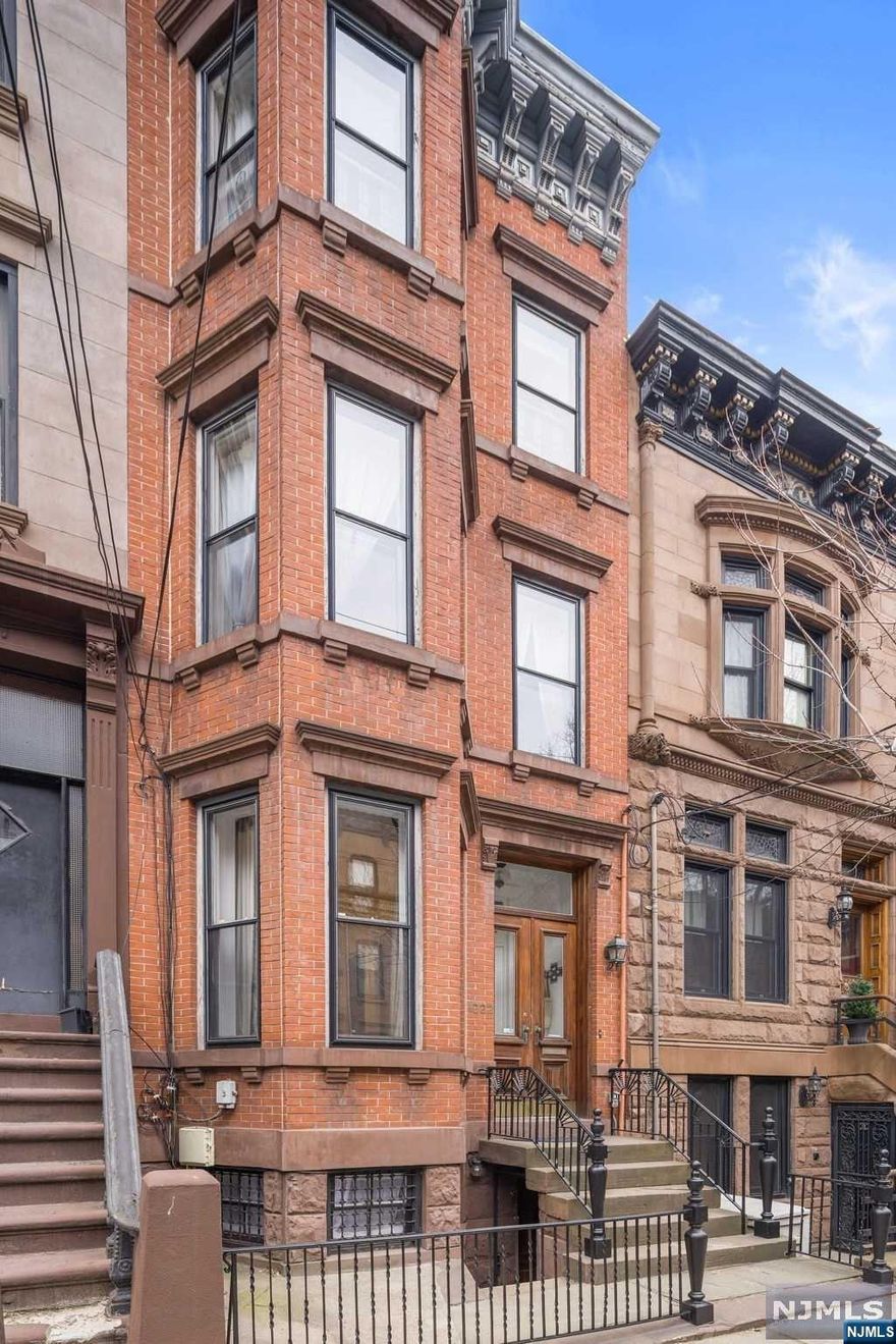 This renovated four-story single-family brick and brownstone townhome sits on a 16.5 x 100 lot, and is located on one of uptown Hoboken's most treasured tree-lined streets. This home offers four bedrooms and three bathrooms over four levels, including a unique four story brick bay that offers an abundance of light through multiple window exposures and a two-story extension over the garden and parlor floors. This single family townhome retains several original details including the handsome, turn-of-the-century staircase with decorative newel post, mahogany banister, original pocket doors and fireplace mantles, and decorative plaster moldings and medallions. The light and spacious parlor floor has high ceilings with a layout that includes separate areas for dining and living rooms, and the extension features a gourmet kitchen with a Wolf 48" duel fuel range with six burner stove and griddle, Viking vent hood, granite countertops, LG dishwasher, Kitchen Aid French door refri...