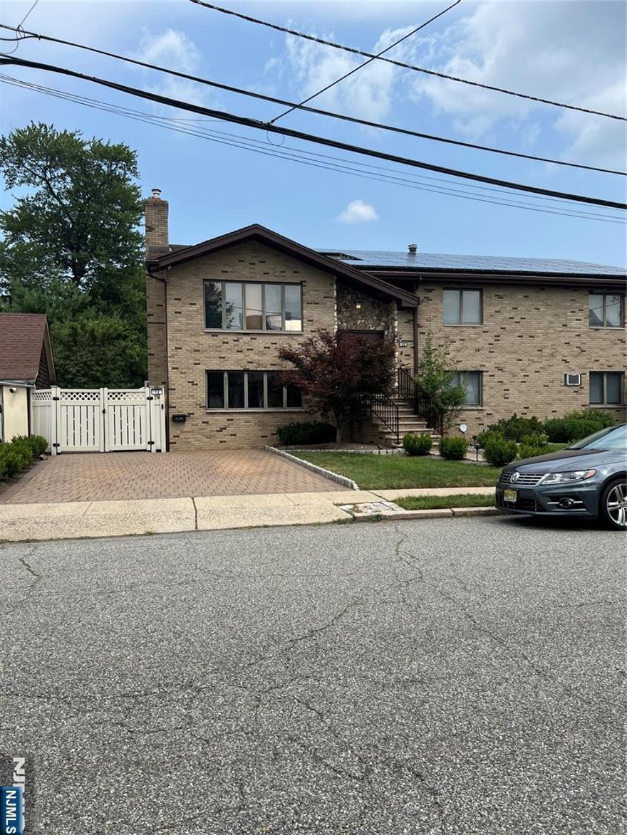 This lower-level unit, recently renovated with fresh paint, features two spacious bedroom, a living room, dining room, kitchen equipped with new appliances and a full bathroom. The unit boasts central air conditioning and hookup for washer and dryer. Addition amenities include two side-by-side parking spaces, a private fence and a spacious side porch ideal for relaxation. Strategically located near transportation, shopping and etc.