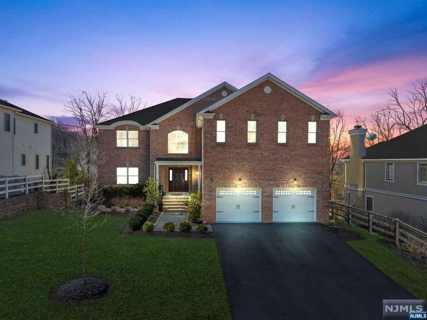 Get ready to experience the ultimate in luxury living with this breathtaking property. Featuring 5 oversized bedrooms, including 3 luxurious master suites, and 6 beautiful bathrooms, this home is sure to impress even the most discerning buyer. The main level of the home offers an office, rec room, living room with fireplace, and an open concept kitchen is a chef's dream, with an oversized layout, top-of-the-line appliances, and plenty of storage space.The fully finished basement is perfect for hosting guests or creating a private retreat, while the backyard is a true oasis with manicured landscaping and plenty of space for outdoor entertaining. With two full garages, you'll have plenty of room for your vehicles and storage needs. From the moment you step inside, you'll feel right at home in this stunning property. Fantastic location, close to all major highways and only 45 min. from NYC.