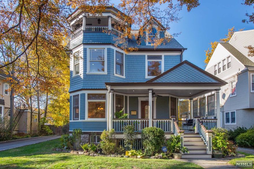 Don't miss this true Montclair Gem! Fabulous Victorian-Colonial meticulously restored to its glory without compromising style and charm, Where Old meets New. You'll fall in love with the welcoming open front porch, large foyer entrance with original staircase, many architectural details , stain glass windows throughout. Sun drenched Formal Living room with Large Bay windows, hardwood floors, pocket doors, Formal Dining Room with wood burning fireplace, Large Bay windows. Renovated eat in kit with stainless steel appliances, Exquisite bright & sunny family room off the kit and mud room leading to rear yard. Powder Room first floor. Upstairs features Primary bedroom with master bath, Shower & Tub and amazing walk-in closet,3 addition large bedrooms , Main full bath with shower-Tub. Laundry - stackable units for convenience. Third floor consists of 2 BRs and an amazing quaint open porch. Fabulous yard, close to train. Move in ready!