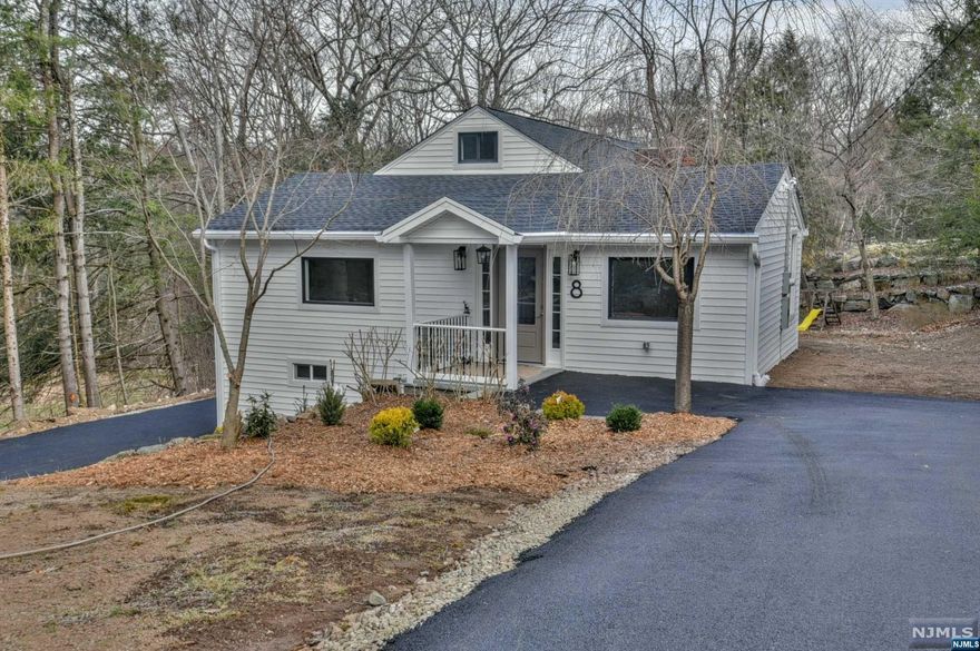 Welcome to this completely renovated contemporary home in the desirable quiet neighborhood,cul-de-sac location. The interior living open space. Updates include new kitchen with wood custom cabinets, Quartz countertops, new oversize sink. SS high end appliances. New sun-filled living room with high ceiling, recessed lights and wood burning fire place. Dining room leads to a covered composite weather proof deck with hook ups to B.B.Q. Master bedroom offers lots of closets. New bathrooms are master of arts with Italian tile. New roof with leaf guard & under ground piping leaders to take water away. New Hvac and central vac, new vinyl siding, new septic. The walk-out lower level, including family room with wine cooler, Bonus room used as an office or guest suite. Enjoy the second floor spacious loft with hard wood floors. Over size back yard, New asphalt, double drive way for 12 cars. Do not miss out Lots of details. House is selling As IS.