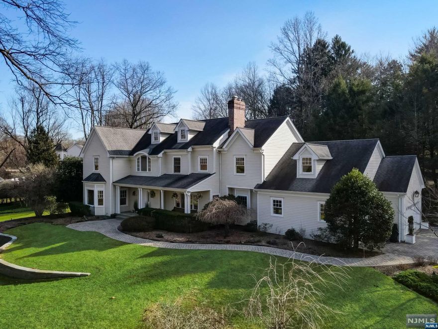 Ideally located luxurious center hall colonial home situated privately on a premier lot with lush landscaping and hard-scape perfect for entertaining guests outdoors. This home features upgraded hardwood flooring throughout, custom wood finishes, professional grade chefs kitchen with sub-zero fridge and viking ovens. This spacious open floor plan offers ample sunlight throughout the home and features an amazing flow. Storage includes oversized closets, full finished basement, three car plus garage and more. This home offers significant upgrades to exceed your expectations such as renovated/upgraded kitchen, upgraded bathrooms including fully renovated oversized master bathroom. Within walking distance to highly rated Woodside Elementary school. This home is an absolute must see and sure to exceed buyers expectations.