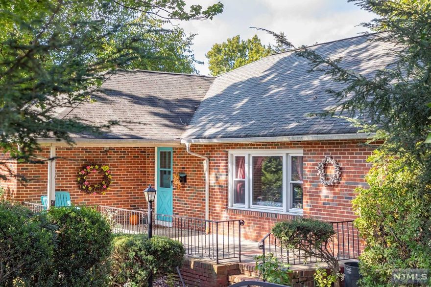 Brick ranch-style home with 3 bedrooms on large lot. Great location with easy access to Pascack Valley passenger rail to Hoboken. Also not far from New Milford high school. The rooms are on the larger side in this home. One car garage with add'l parking for 3 cars. Lovely front patio overlooking large grassy front yard surrounded by shrubs for privacy. In the kitchen the stove and dishwasher are 5 years old, the fridge is 10 years. The hardwood floors were refinished and look very nice. Older, but serviceable kitchen cabinets, full bath, and 1/2 bath. HVAC is 10 years old. 100 amp service. The full basement is huge and would provide great living space, but needs a total reno. Fireplace never used and owner does not know if it works. Basement had about 5 inches of water from Ida. Everything dried out now. Home being sold strictly AS IS. Seller will not make any repairs or give any credit for repairs.