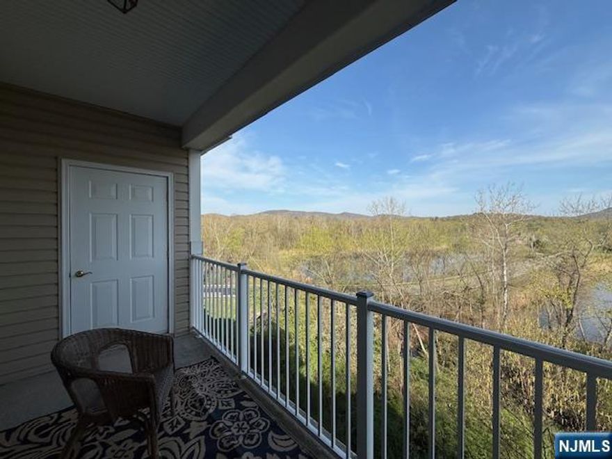 Location within a location.! Panoramic mountain views make this penthouse condo a stand out. This is a private and gated adult community for discerning and active residents. Enjoy the clubhouse which offers an indoor pool, fitness room, cafe, movie theater, craft room, sauna, billards, a ballroom reception area where you can sit by the fireplace, have a bite to eat, play cards and gather. The clubhouse is a short walk across the road from building 9. Outdoor activities include a bocci court, tennis, outdoor pool and there's so much more to enjoy while living at Wanaque Reserve. The large eat-in kitchen is equipped with a pantry closet, ample cabinetry and plenty of counter space with access to the laundry room with the washer & dryer included and a brand new water heater. A formal dining room for hosting dinners and everyday meals. The living room with sliding glass doors opens to the private balcony with a storage closet and the best view of the mountain range and nature showing it's best during each season. Both bedrooms, the den and living room also look out onto the view. French doors open to the den which can be used as a TV room, home office or to suite your needs. The beautiful hardwood flooring runs through the main living area. Located on the 4th floor this unit is only steps away from the elevator. This truly is a wonderful place to call home.