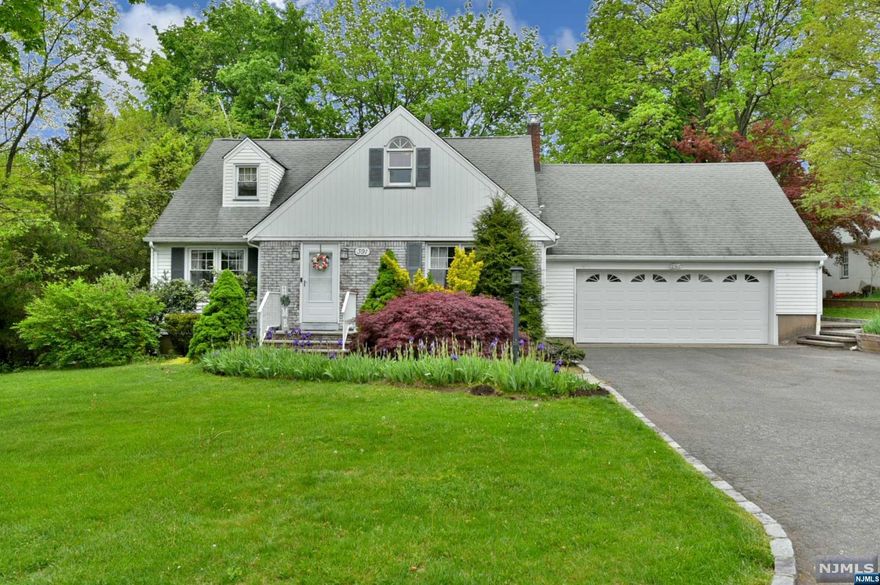 Well maintained home located on a circular street with minimal through-traffic. Front entry offers coat closet leading to living room, updated kitchen with island, two large bedrooms and a full bath. An all-season porch, currently used as dining space, in rear of home leads to a paver patio, fenced-in backyard with a shed. Second floor features the primary bedroom with an updated full bath. There is also a nursery/office space, a walk in closet and access to the large storage area above the 2 car garage that can be converted into additional living space. The oversized two car garage has direct access to the backyard and stairs down to the partially finished basement with laundry and kitchenette. The home has hardwood floors throughout and lots of storage space. Lots of expansion possibility. Entire home is equipped with a water filtration system.