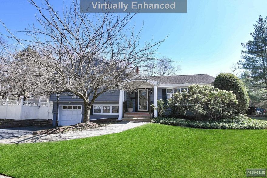 EAST HILL Closter Expanded 3 Bedroom, 2 1/2 Bathroom updated home with amazing BACKYARD OASIS. Welcoming entry brings you to the spacious living rm & dining rm off of the eat-in kitchen w/stainless steel appliances, granite counters & updated cabinets. Bright sun rm/family rm addition is practical for hosting guests or everyday living w/fireplace, wet bar & sliding doors to the private backyard with deck, pergola, heated pool. Upstairs boasts 3 large BRs & 2 full bths, including a primary en suite renovated bath. Ground floor level is perfect for home office or den and has a bathroom easily accessible to the pool along w/a mud area & garage access. Basement recreation space w/wet bar, hang out space as well as laundry, storage closets & utilities. Hardwood floors under carpeting & mature professional landscaping. Great location in a beautiful neighborhood close to new Closter Plaza, NYC transportation and easily accessible to 9W & GW Bridge. This is a GEM!