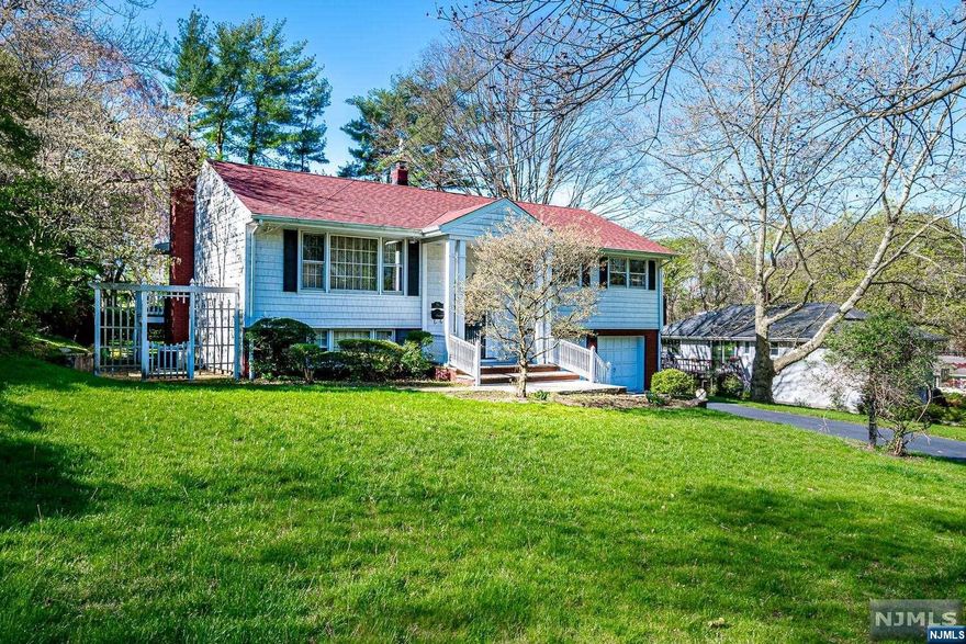 Discover the perfect canvas for your dream home in this spacious 4-bedroom, 2.5-bathroom bi-level, boasting an expansive 4-car garage and nestled in a beautifully landscaped setting. This property features a Gas Generator making it ready for any situation and a large eat-in kitchen, Hardwood Flooring: Enjoy the timeless elegance of hardwood floors throughout the home. Family Room with Fireplace: Cozy up in a welcoming family room, complete with a charming fireplace. Solarium and Outdoor Space: Bask in natural light in the solarium, or step out to the backyard, ideal for outdoor cooking and entertainment. This home offers both tranquility and convenience. Close to shopping, dining, and easy access to major highways and NJ transit trains to New York City.While this home requires some TLC. Open House canceled on Seller RequestMultiple Offers HIGHEST & BEST SUNDAY BY 5PM