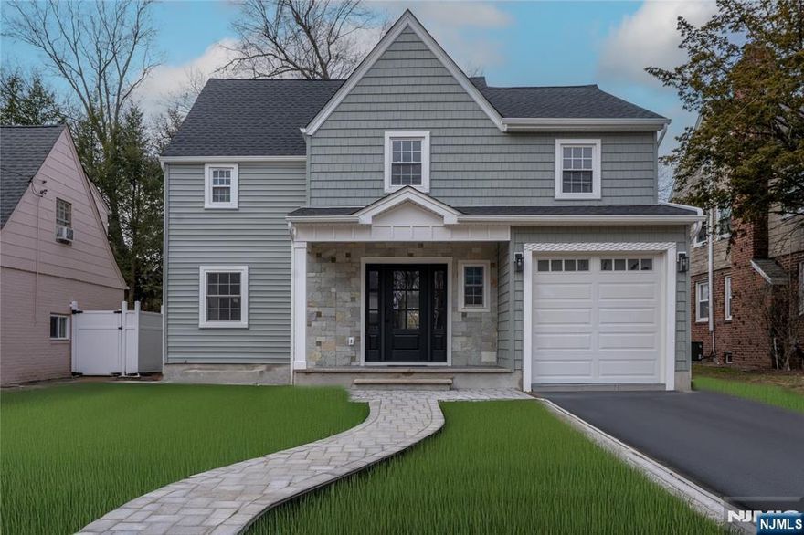 Totally renovated 5-bedroom 3.5 bath colonial in central Teaneck location. Main level features a bright living room, spacious dining room, ultra-modern eat-in kitchen complete with double appliances, high end cabinets, quartz counter-tops and access to yard. A mud room, powder room and attached garage complete the first level. The second level consists of a master suite with Tray ceilings, his and her closets and master bathroom complete with extra-large shower. 3 additional bedrooms, a full bathroom an office and laundry complete the 2nd fl. The 3rd level consists of a spacious guest room/ rec room. The lower level features a large recreation area, legal bedroom, utility and storage. House is totally renovated inside and out.