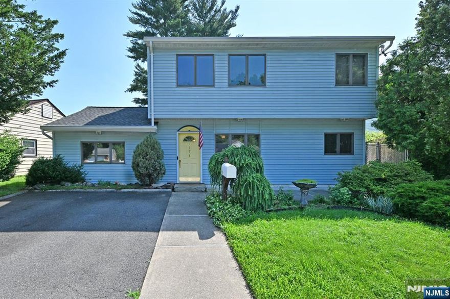 Deceptively large expanded 5 bedroom colonial/cape, in quiet neighborhood of desirable Rochelle Park! Features include huge king size primary suite w/large walk-in closet, new renovated primary bathroom, plus a terrific private deck of the primary bedroom overlooking the backyard! 2nd huge BR on 2nd flr is like a 2nd primary BR! Convenient laundry on 2nd flr too. Open 1st flr layout from eat-in-kitchen to living rm/dining rm combo. Additional large bedroom on f1st flrr could be rec room, playroom, gym, large home office and Moore! Was originally a Garage, so could be converted back if preferred. Also a terrific backyard to unwind & enjoy, with many mature, plantings, plus a great BBQ patio! All this plus central air conditioning, close to NYC bus, shopping and malls, ShopRite, and just one block from the entrance to fabulous Saddle River Park! Amazing potential for this large expanded five bedroom two bathroom home! FAST CLOSE PREFERRED !