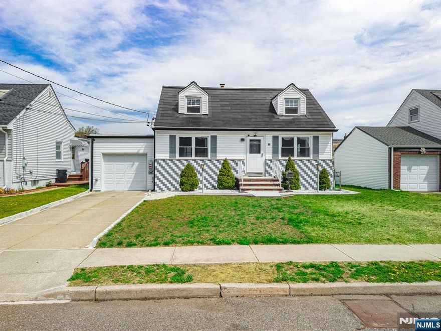 Move right in! This beautifully maintained home in ideally located in Bergen County, near schools, shopping, NJ Transit, and just one block from Carlock Field, featuring a playground, turf field, activities, events, camps, and more. On the first floor, youâ€™ll find gleaming hardwood floors, a bright and spacious living room, convenient primary bedroom, second bedroom, a full bath, and a functional galley kitchen with adjoining dining area. Upstairs, youâ€™ll find two additional nice-size bedrooms and plenty of natural light. The full, walk-out basement offers excellent potential to finish and customize to your needs. Step outside to a level, charming backyard, perfect for relaxing or entertaining. A standout feature is the newly installed Tesla roof, offering sleek, modern efficiency along with the added benefit of energy generation. Donâ€™t miss the opportunity to own a home in a convenient and desirable location.