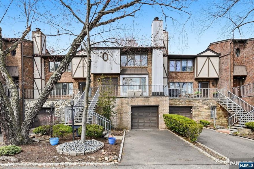 Light, bright, and spacious! Beautiful Montclair Heights section of Clifton Townhome. Updated eat in kitchen with rich cabinetry and stainless steel appliances, Powder room, Double door entry to large living room with woodburning fireplace and marble surround, and Formal dining room with sliders to a private rear patio. Huge lower level family room, office, powder room and entry to the attached garage and extra parking. Spacious Ensuite with a stall shower bath and plenty of closets, 2nd bedroom and a 2nd full bath. Beautiful flooring throughout. Minutes away from direct transportation to NYC and bus to Port Authority. Enjoy all the wonderful shops and restaurants of Upper Montclair just minutes away!