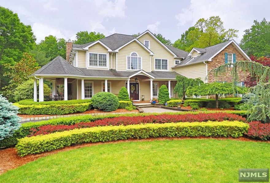 STUNNING DREAM HOME FEATURING ALL THE ELEGANCE, SPACIOUSNESS, FUNCTIONALITY, & ENTERTAINMENT VALUE YOU WOULD HOPE FOR AT A GREAT PRICE. THIS 7500 SQ FT HOME ON 1.3 ACRES IS METICULOUSLY MAINTAINED, UPDATED & UPGRADED. HIGHLIGHTED BY A CUSTOM GOURMET KITCHEN, MASTER SUITE WITH MOVIE-LIKE WALKIN CLOSET, FOUR OTHER BEDROOMS ON SAME LEVEL, A GYM & WINE CELLAR IN BASEMENT, FOUR SEASON SUNROOM, THREE CAR GARAGE, MAHOGANY WRAP-AROUND PORCH, A FULLY FENCED-IN BACKYARD WHICH BACKS UP TO 16 ACRES OF SCENIC WOODS. OTHER UNIQUE CHARACTERISTICS INCLUDE 3 GAS FIREPLACES, VAULTED CEILINGS, STONE TILE, CUSTOM WOODWORK & MORE. TOP RATED SCHOOL DISTRICT, GREAT SHOPPING & DINING EXPERIENCE, EASY ACCESS TO NYC BY TRAIN, BUS, OR HWY. 2ND MASTER SUITE IS POSSIBLE UPSTAIRS. TENNIS COURT & IN-GROUND POOL ALLOWED IN CURRENT ZONING.