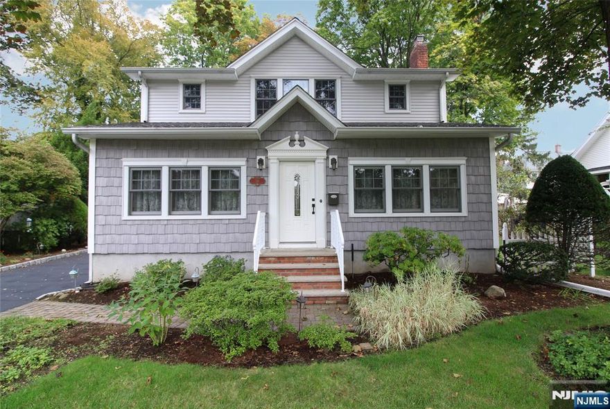 Charming and meticulously maintained colonial with elegant updates throughout. A rare find with each bedroom offering its own walk-in closet. The inviting living room features a gas fireplace, original white oak hardwood floors, and beautiful crown molding that adds timeless character. The sunny enclosed porch with heat and central air is perfect for year-round enjoyment. Additional features include a hardwired security system, whole house generator, and insulated detached two-car garage. A truly move-in-ready home that combines classic charm with modern convenience.