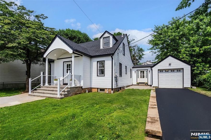 Stunning!! Step inside this sophisticated and stylish newly gut renovated and expanded home and you will immediately admire the spacious formal living room open to the dreamy chef's kitchen with custom designed cabinetry, huge center island, six burner range, beverage cooler, under cabinet microwave and elegant quartz countertops. Kitchen also opens to rear family room/dining room addition with a wall of windows overlooking new paver patio and oversized yard. Two bedrooms and beautifully appointed full bathroom complete the first floor. Second floor primary bedroom oasis invites tranquility with vaulted ceilings and partial skyline views. Spa like primary bathroom features freestanding tub and swoon worthy walk in shower. Full finished basement with third full bathroom offers an additional 800+sf of living space ideal for home office, theatre, rec room, etc. Every inch of this home has been renovated to perfection with superior quality and craftsmanship including all new plumbing, electric, multi-zone HVAC, roof and gutters, wood flooring throughout, attached one car garage with direct interior access and so much more. This fabulous Wood Ridge location is a commuter's dream with multiple NJ Transit express bus and train options. This is the home you've been waiting for!