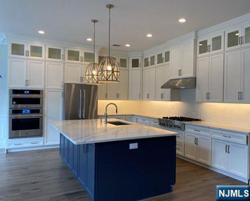 Fabulous Elgin II floor plan, with elevator to all levels of home. Large, open floor plan perfect for entertaining. The kitchen area features upgraded appliances with 6 burner slide in gas range and wall oven, and built in 42" refrigerator. Floor to ceiling cabinets with glass uppers in white with dark grey island. Stunning Taj Mahal quartzite counters. 7.48 wide Provenza Lugano European Oak flooring throughout the home. The finished lower level features a full bath, and even more room for additional entertaining space. The location is private, with no one located behind the residence and partial views to the pond and golf course. Expanded patio with Green Giant Arbor Vitae offers even more privacy. Located in the sought after community of The Fairways At Edgewood, this home is one of the final opportunities to purchase, with under 36 homes remaining.