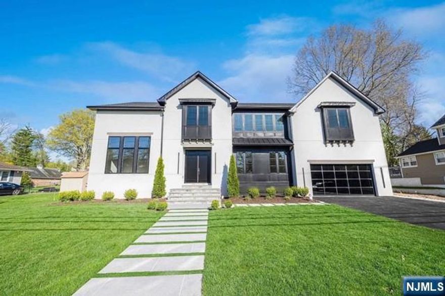 Be mesmerized by this extraordinary architectural tour de force, an ode to refined craftsmanship meticulously constructed by a distinguished local builder upon an expansive 3/4-acre lot. Famed for masterful construction and sublime finishes, every facet of this bespoke abode elevates luxury living. A versatile layout presents two lavish primary suites with ensuite bathrooms on each level, ensuring both residents and guests experience unparalleled comfort. Dual laundry rooms on each floor epitomize convenience, while indulgent relaxation and entertainment spaces invite blissful respite. A covered porch metamorphoses the outdoors into a secluded sanctuary reminiscent of an upscale resort, perfect for hosting memorable soirees. The voluminous basement, with its striking 9-foot ceilings, holds vast potential for future personalization and expansion, establishing this remarkable estate as a testament to visionary design and opulence.